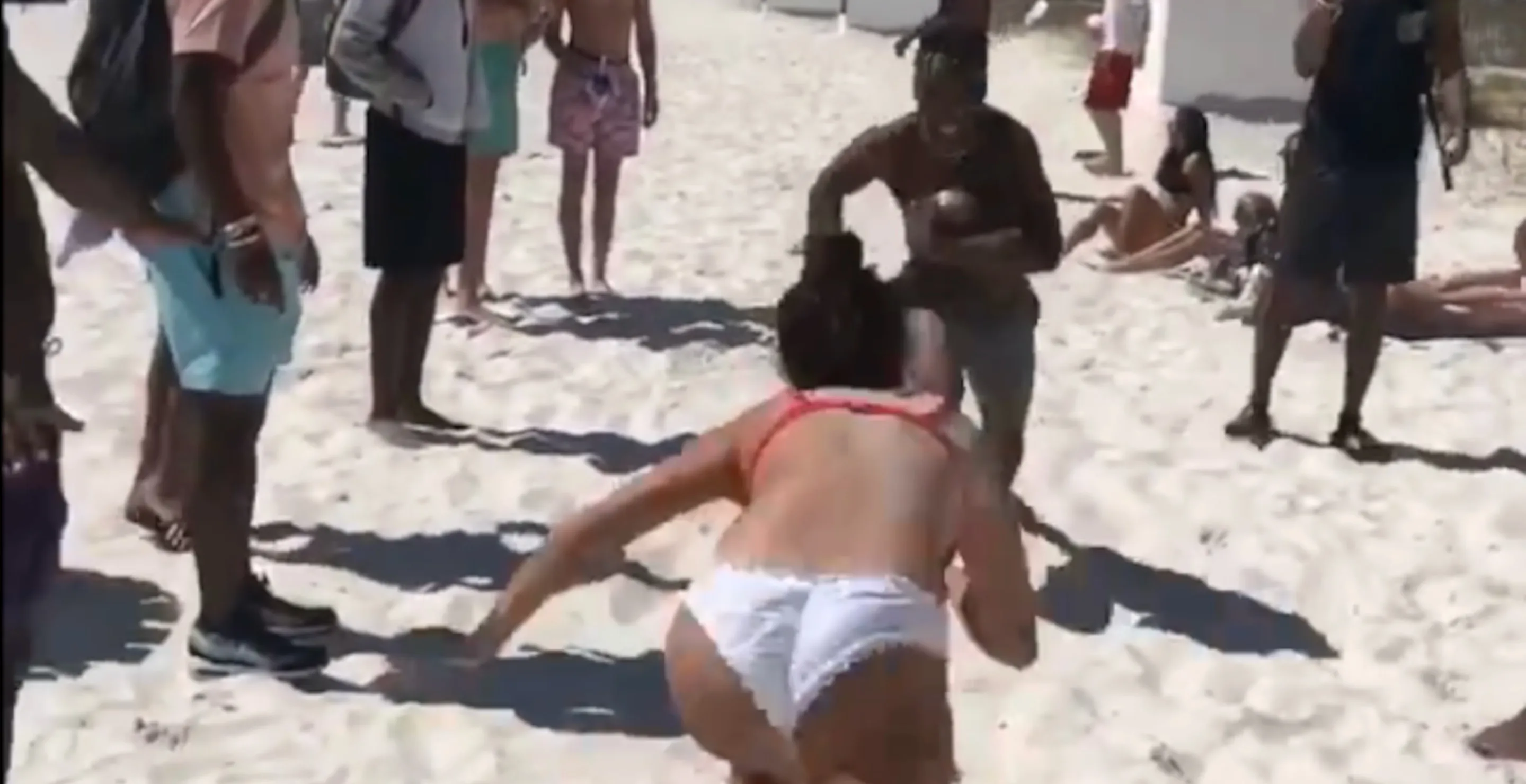 Internet Shocked By Man With Football's Brutal Tackle Against Bikini-Clad Woman On The Beach