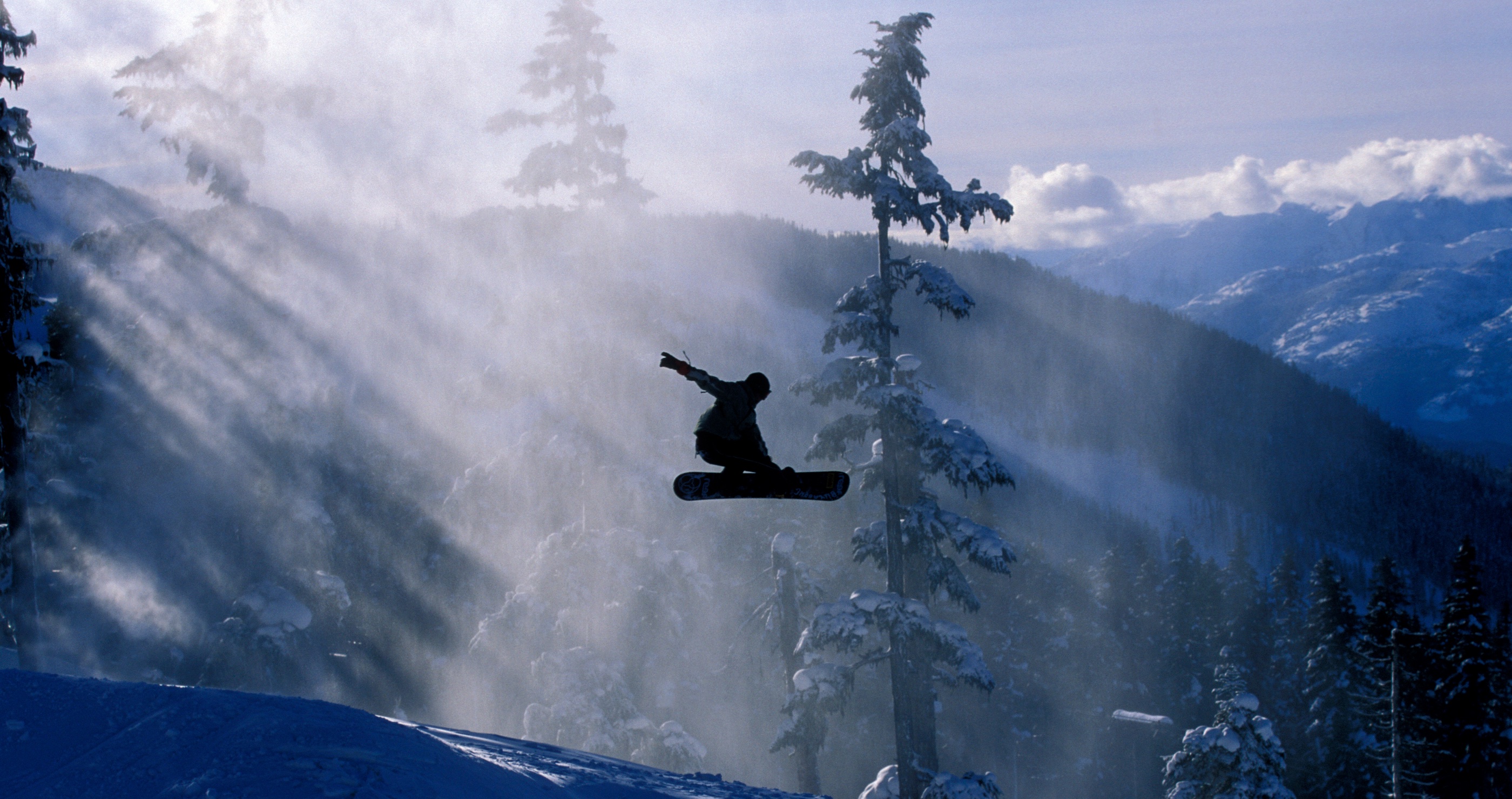 snowboarder wipes out hitting a black bear