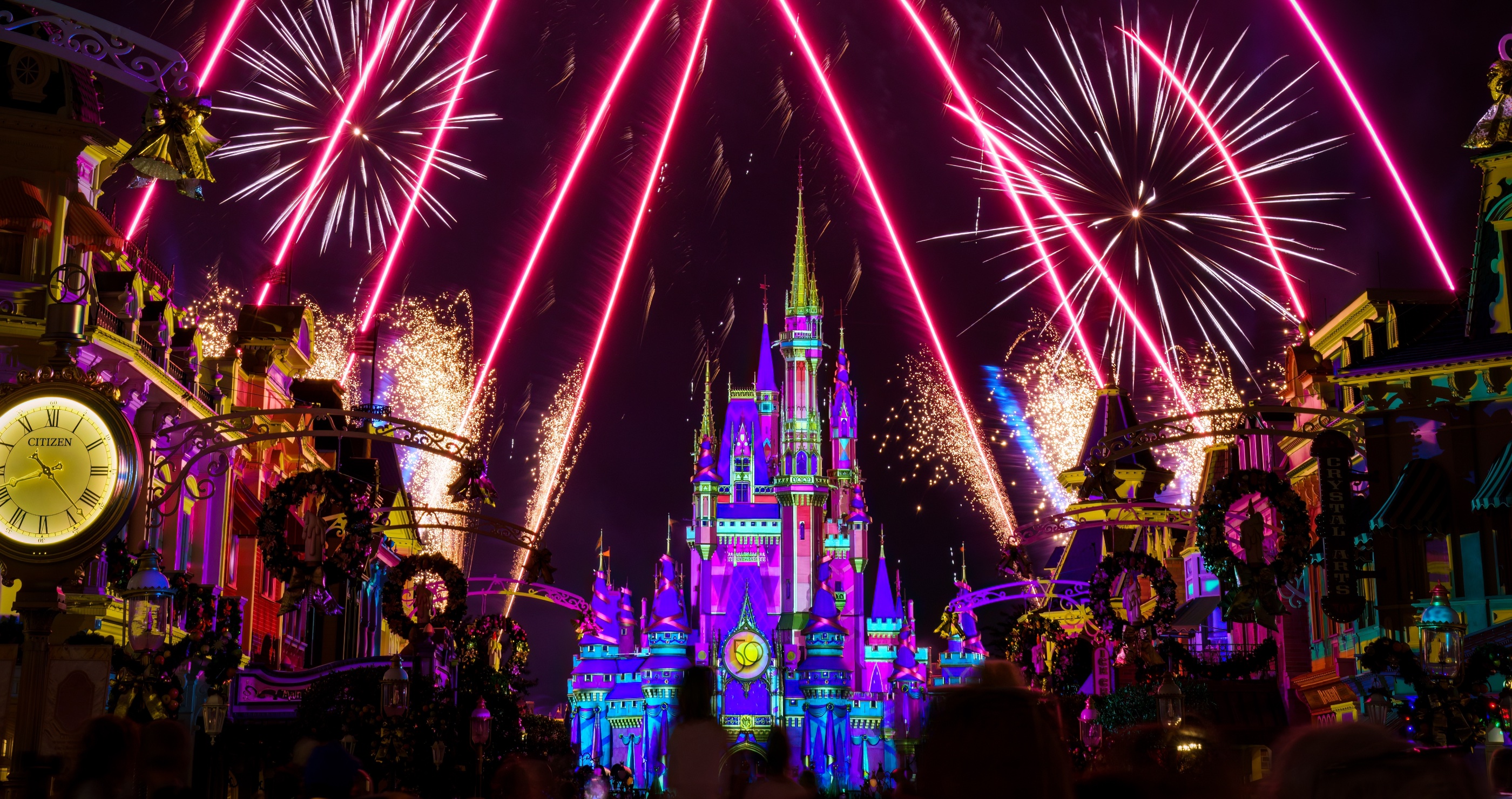 Image of Magic Kingdom Main street at night with fireworks