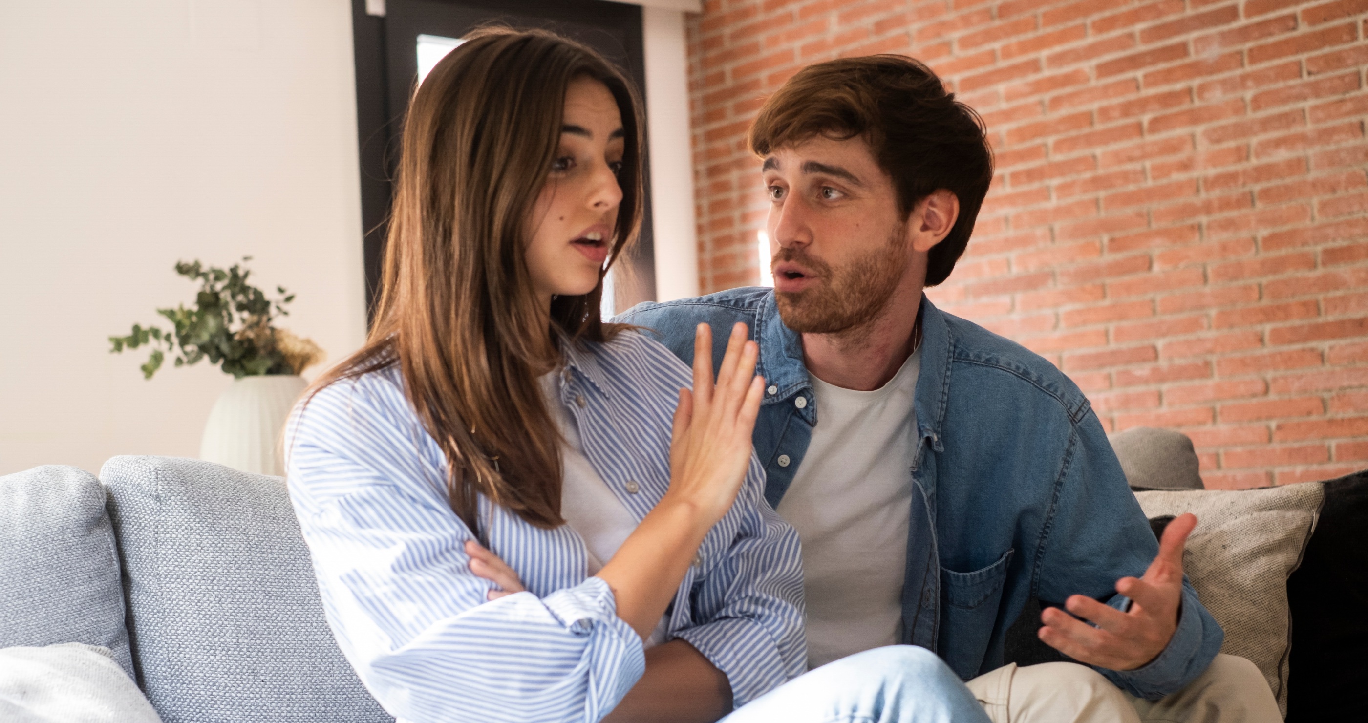 Photo of a couple fighting on the couch